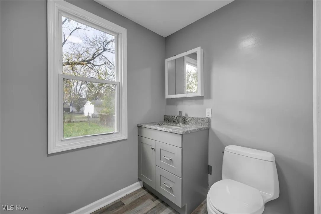 Bathroom with vanity and dark wood finished floors