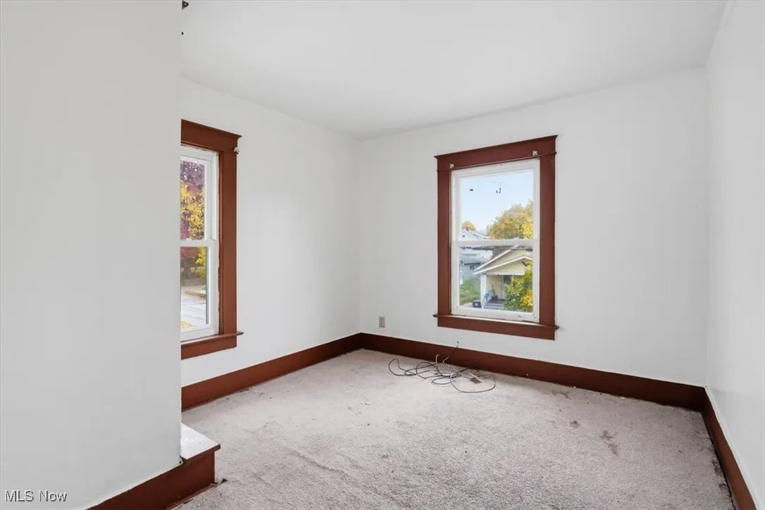 Spare room featuring carpet