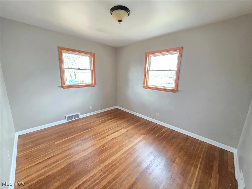Unfurnished Bedroom featuring wood flooring
