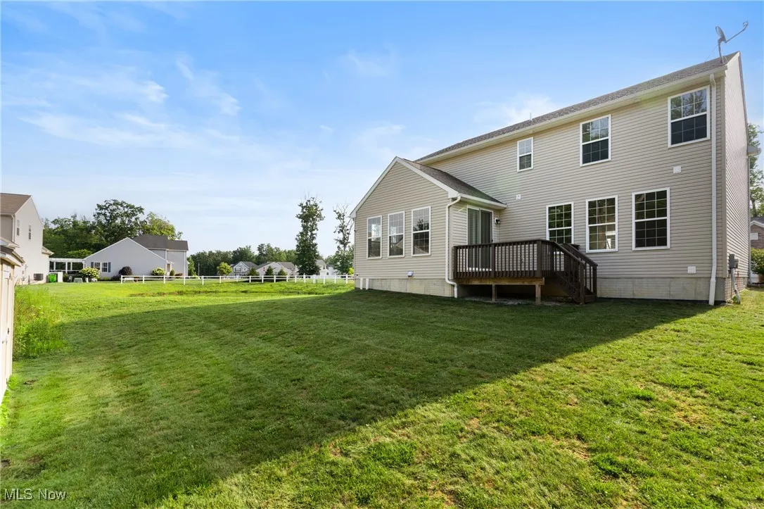 Back of property with a deck