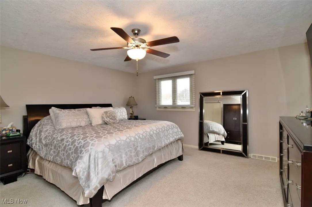 Primary Bedroom with custom blinds
