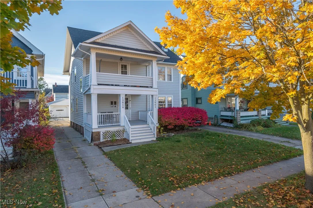 View of front of house with a front lawn and covered porch