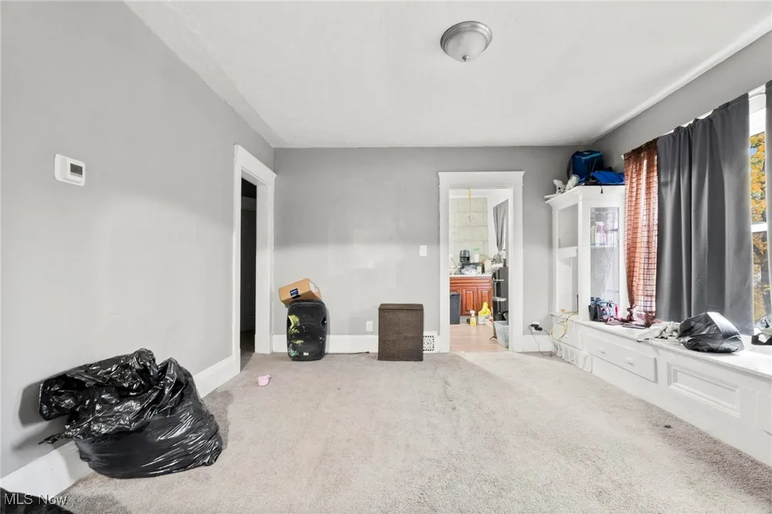 Carpeted bedroom with baseboards