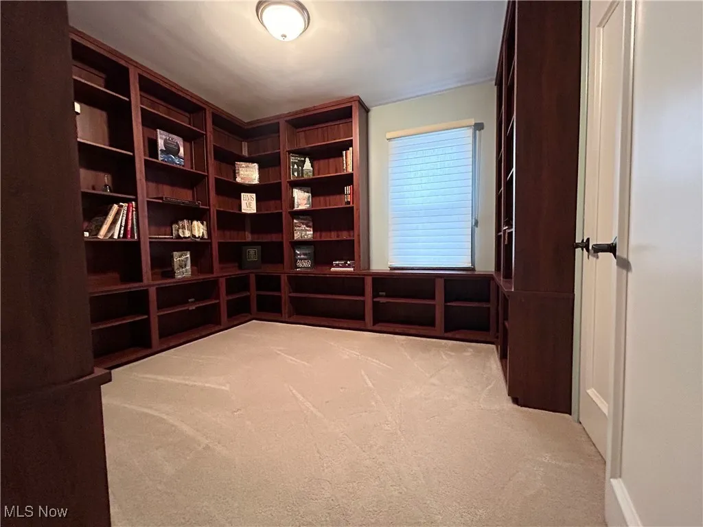 Bedroom on first floor with bookshelves