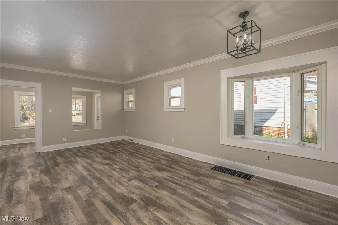Living room/dining room combination with fresh paint and new flooring