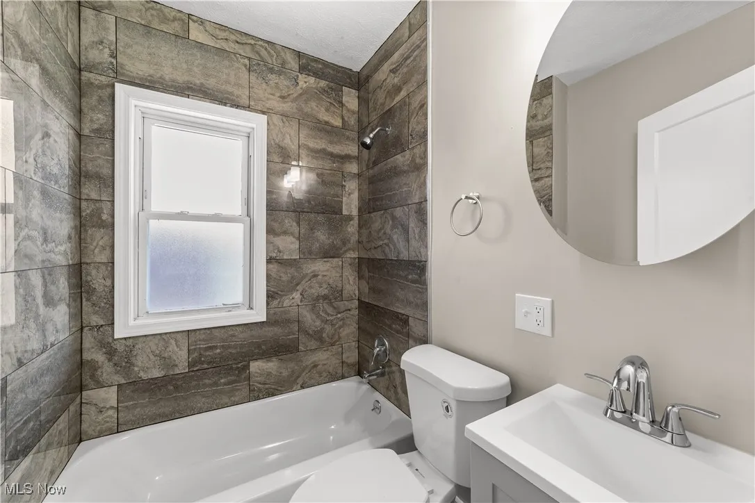 Full bathroom featuring bathtub / shower combination and vanity