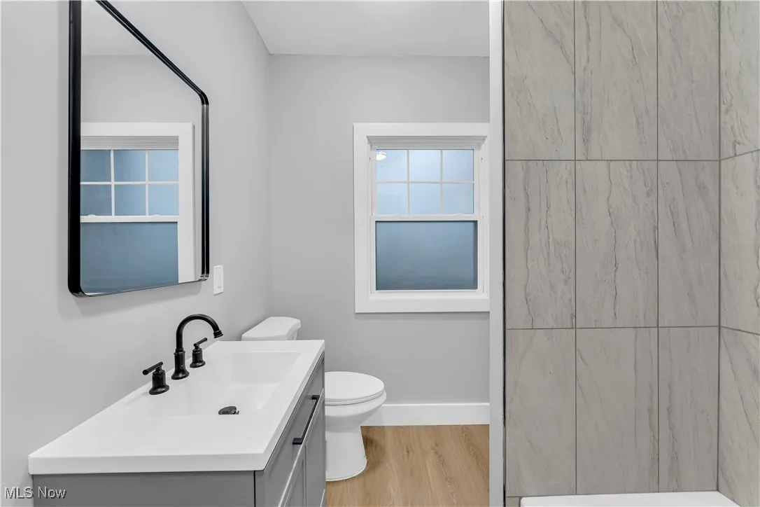 Bathroom with vanity and light wood-type flooring