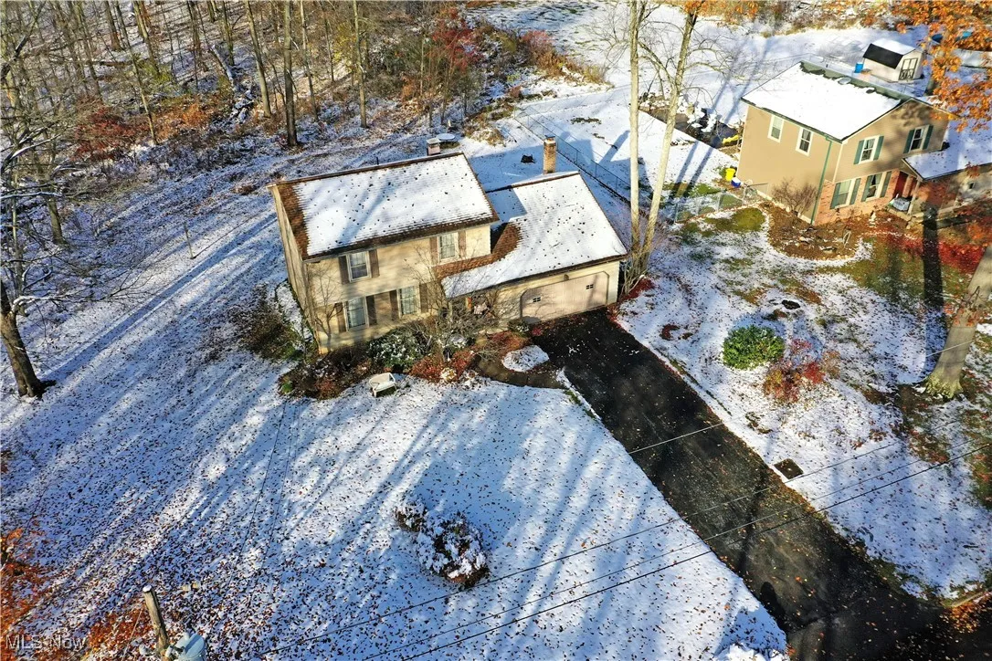 Snowy aerial view with a residential view