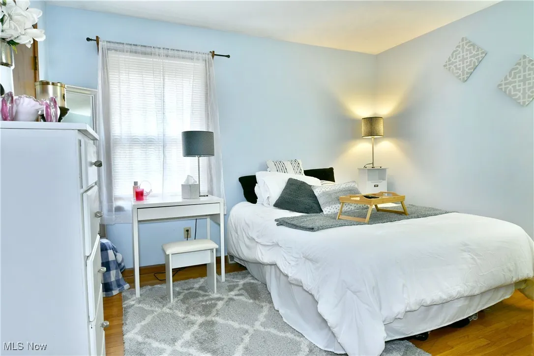 Bedroom with light wood-style flooring