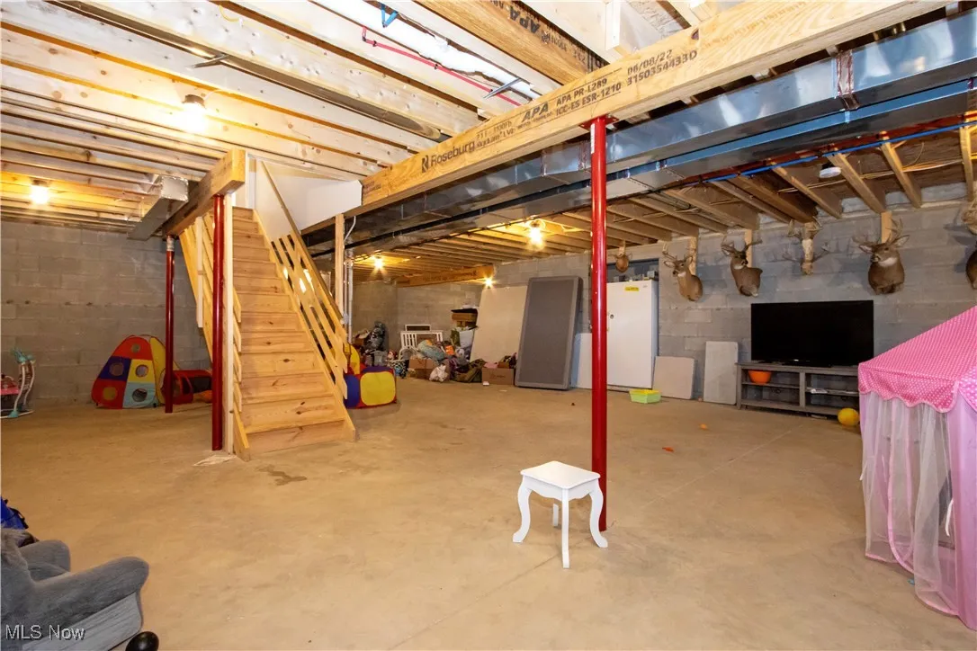 Unfinished basement with stairway