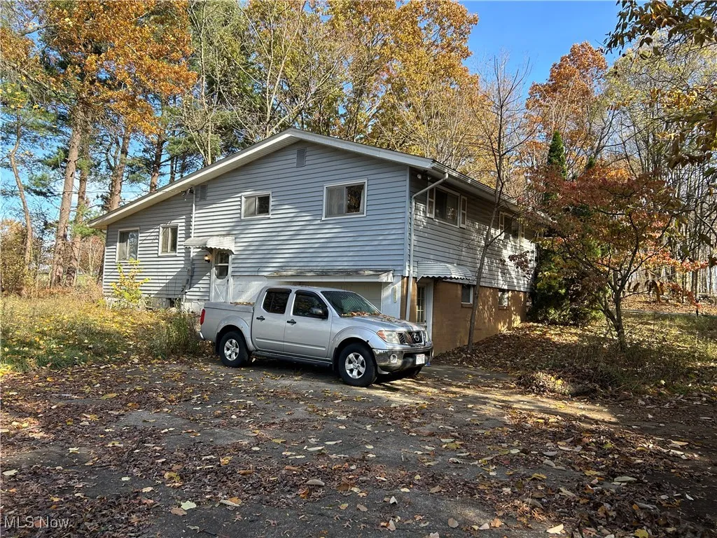 View of home's exterior featuring driveway