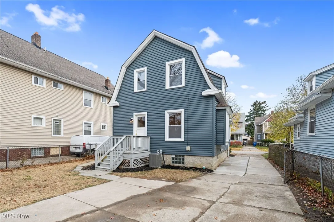 Back of house featuring a gambrel roof
