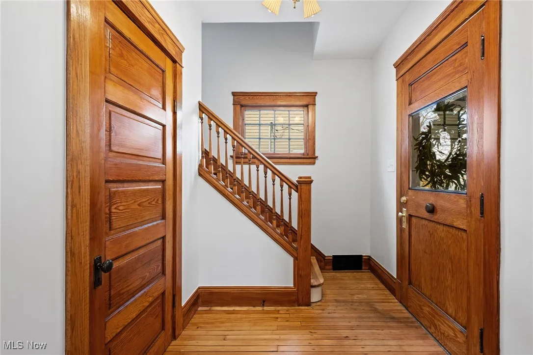 Entrance foyer featuring light wood finished floors and stairway
