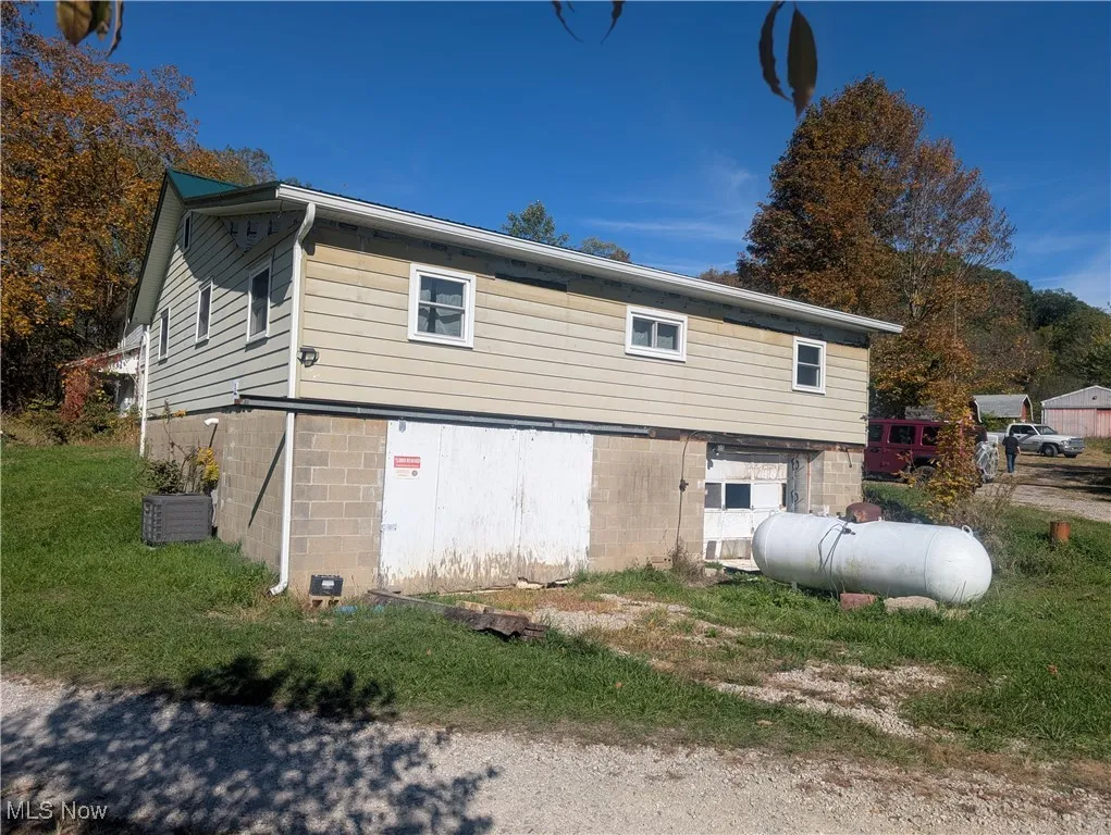 View of home's exterior with a cooling unit