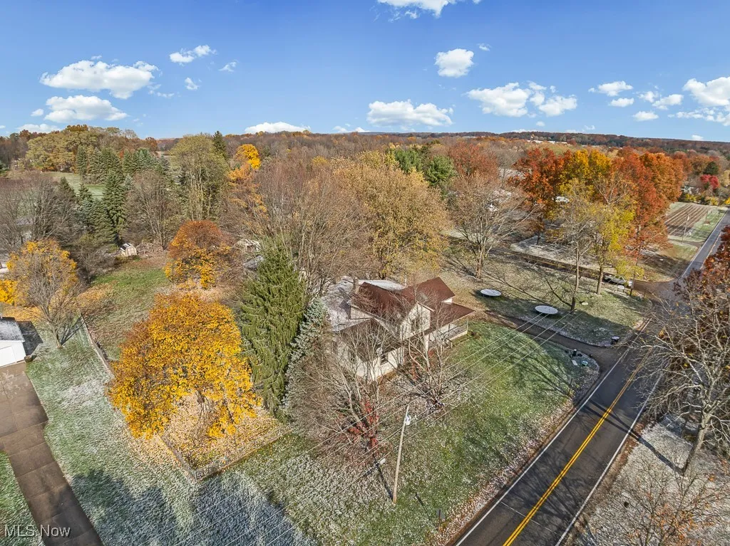View from above of property featuring a heavily wooded area