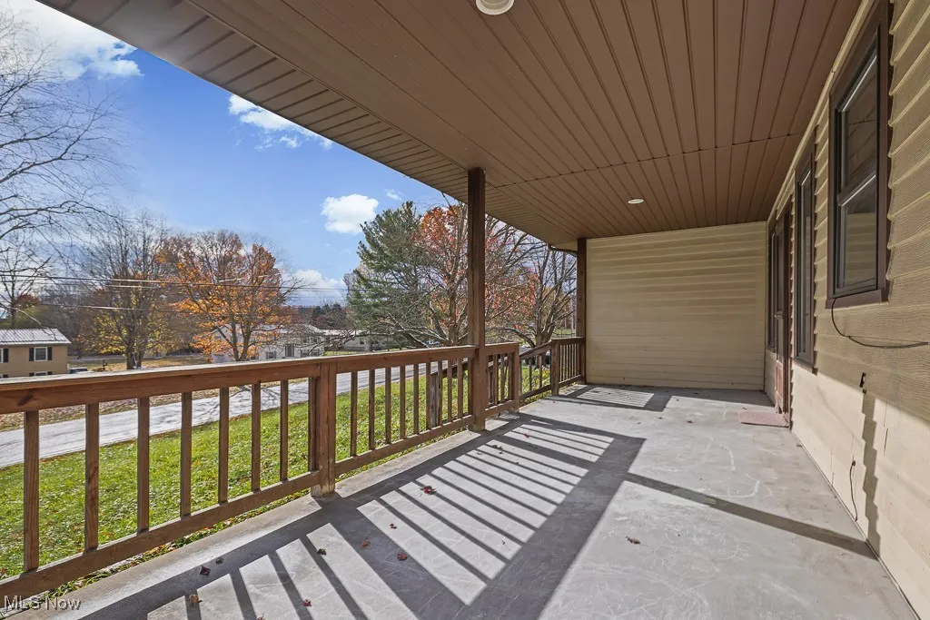 Balcony featuring a sunroom