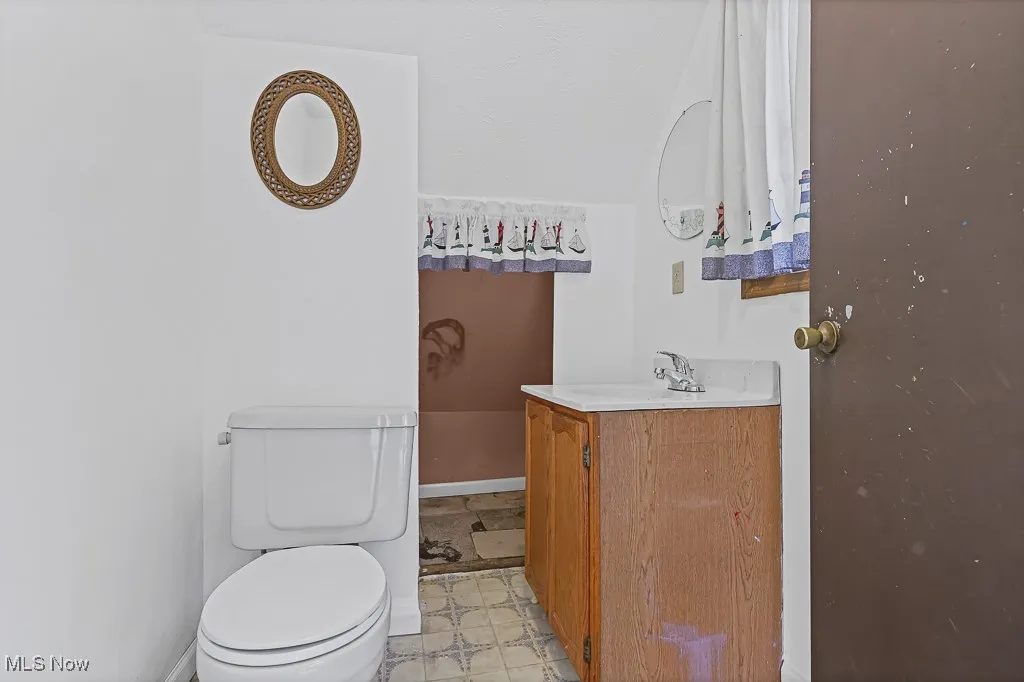 Bathroom with vanity and toilet