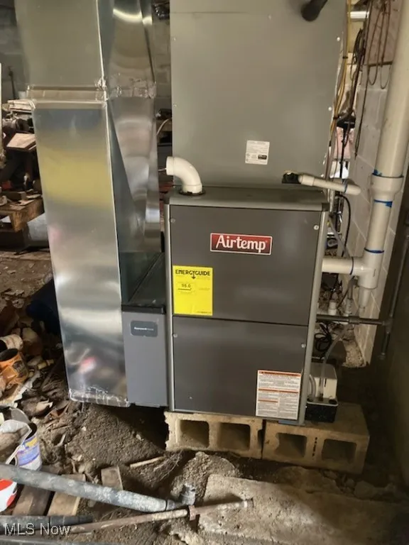 Utility room featuring heating unit