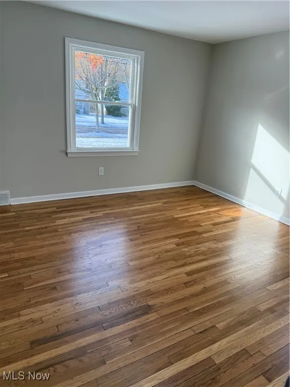 Empty room with light wood-type flooring