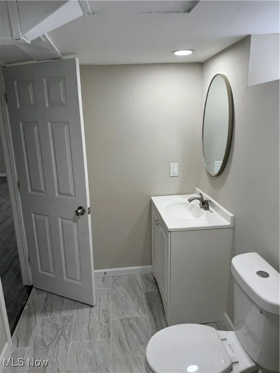 Bathroom with toilet and vanity