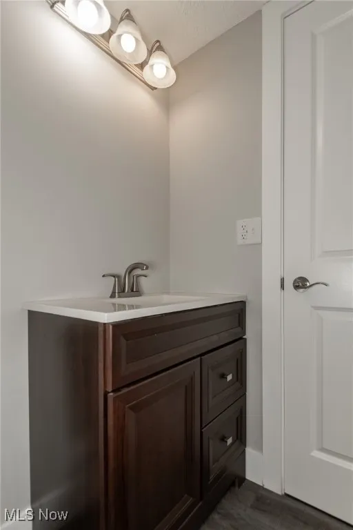 Bathroom with vanity and a textured ceiling