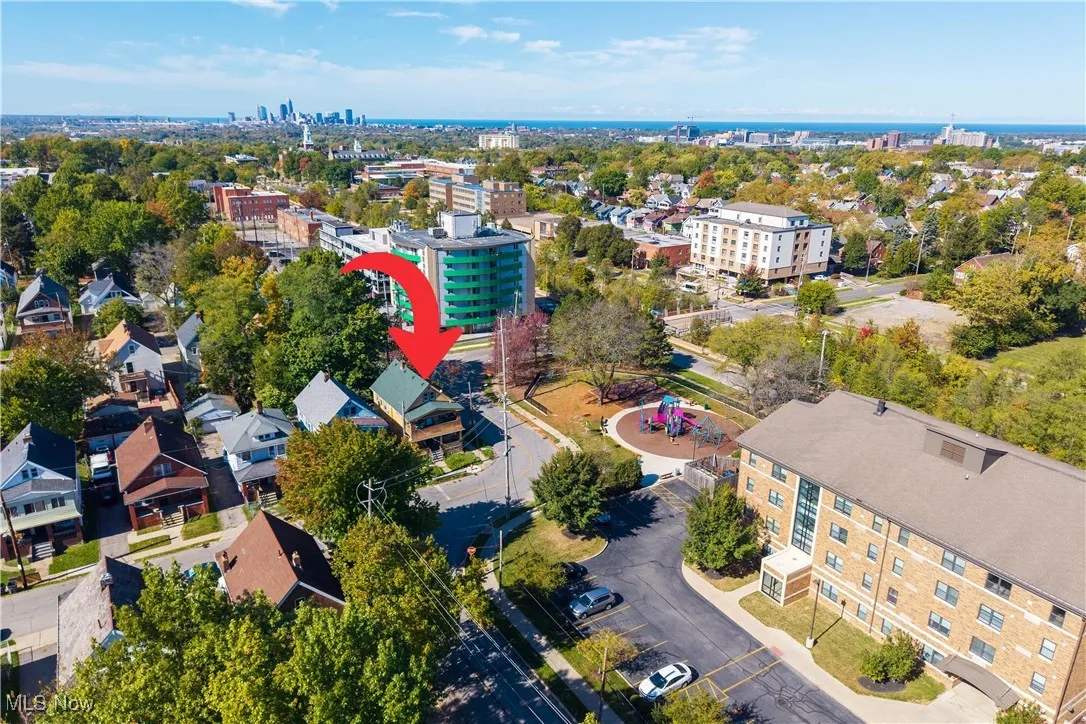 Aerial view of house.  Downtown Cleveland and Lake Erie in the background.