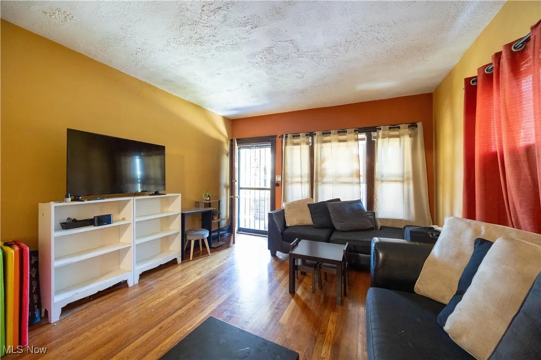 Lower unit family room with wood finished floors