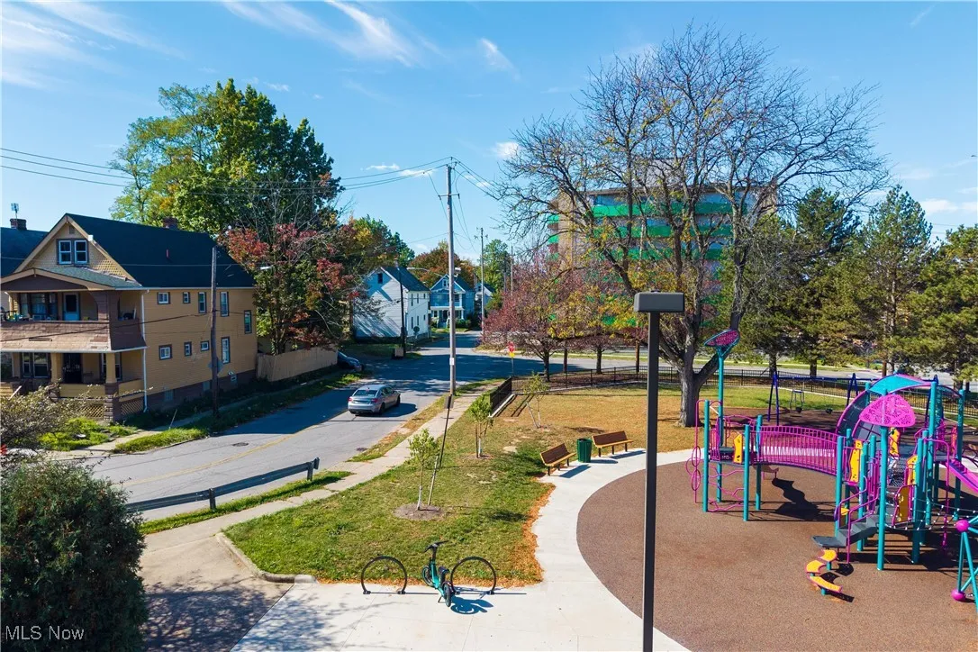 View of community area featuring kids park across the street
