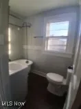 Full bath featuring toilet and vanity