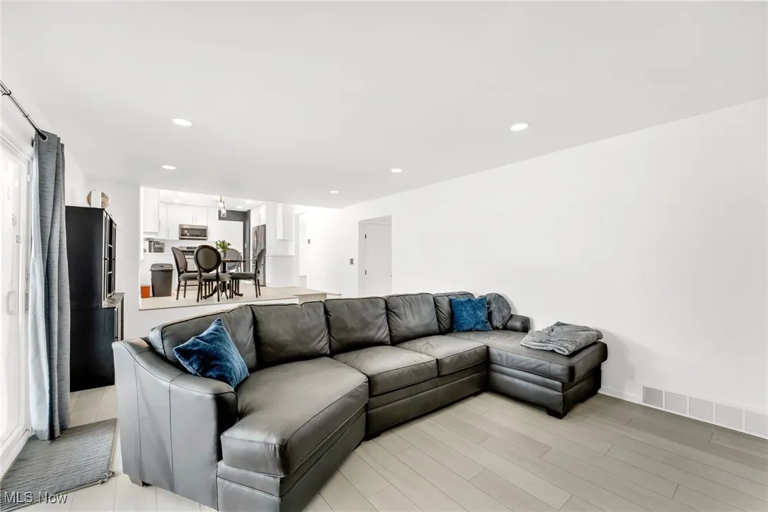 Living area featuring recessed lighting and light wood finished floors