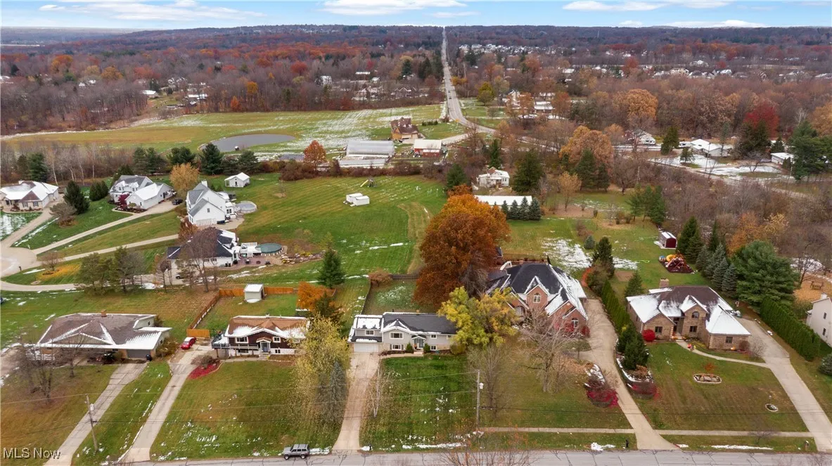 Aerial view of property's location featuring nearby suburban area