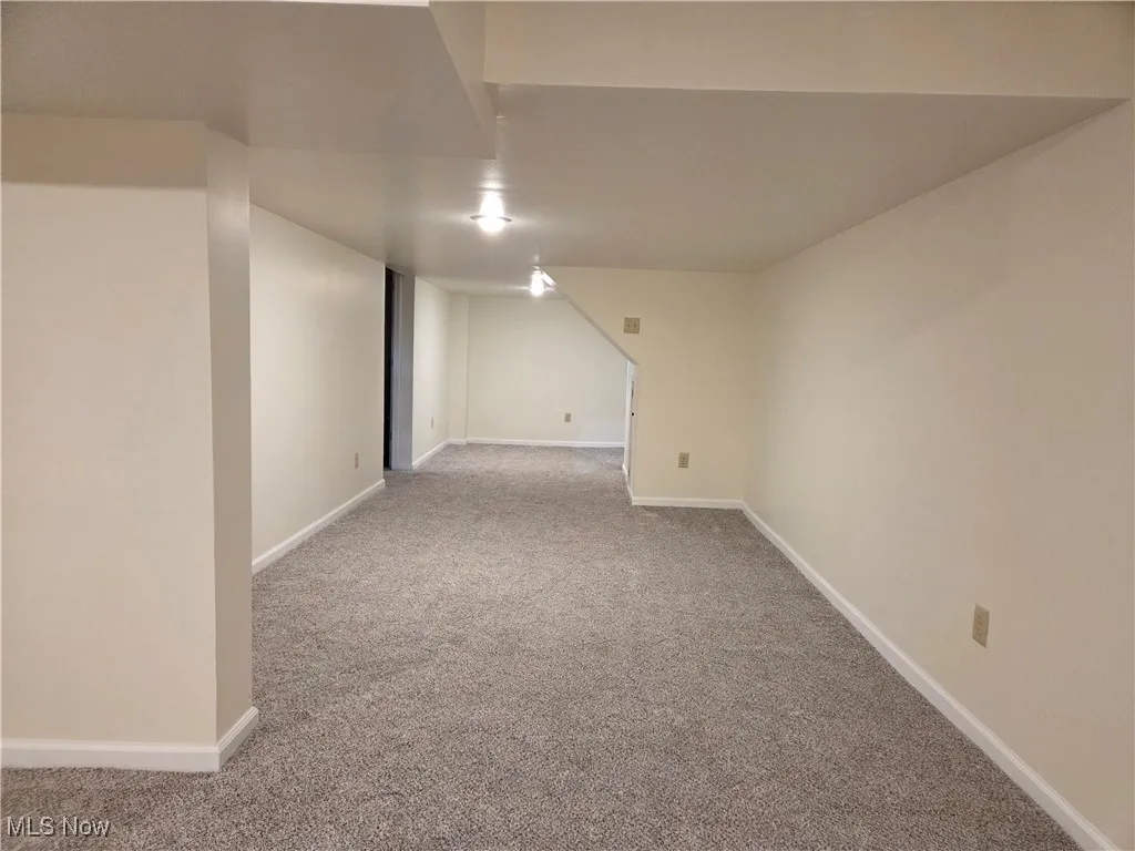 Finished below grade area with light colored carpet