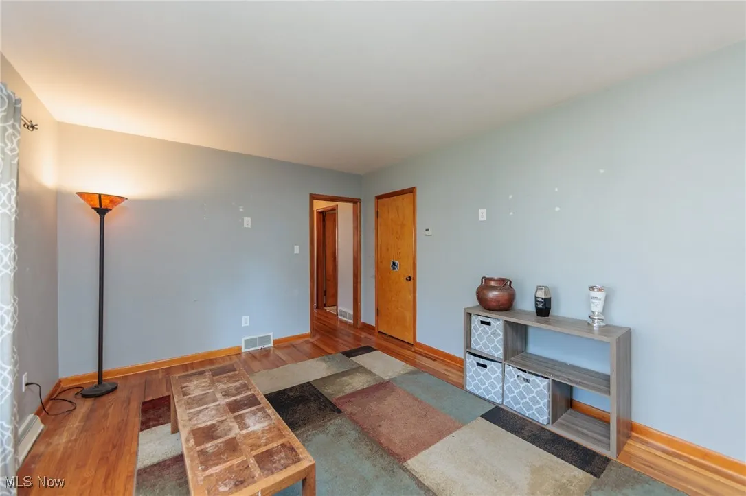 Living room featuring wood finished floors and baseboards