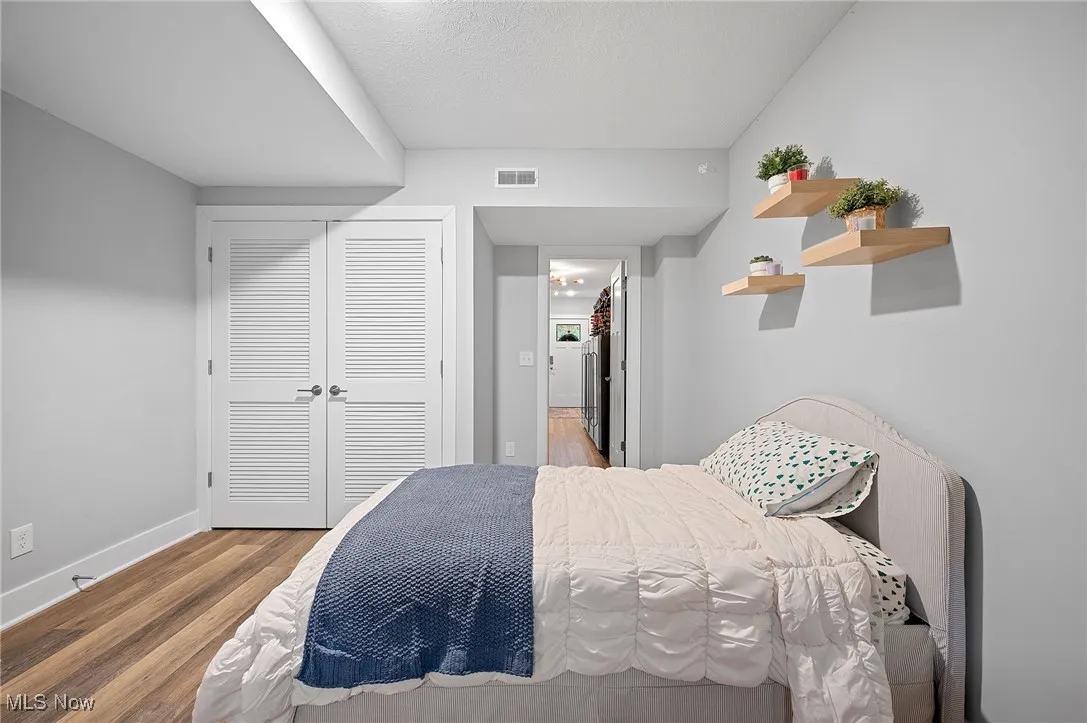 Bedroom featuring a closet and wood finished floors