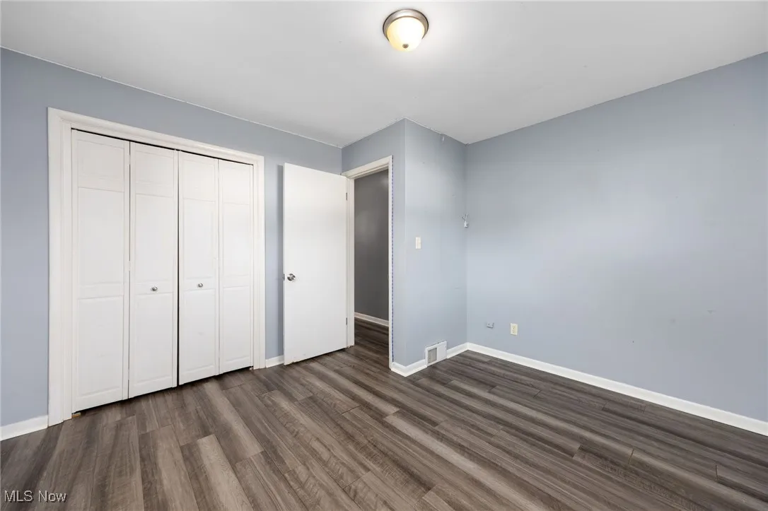 Bedroom 2. Large closet, laminate flooring.