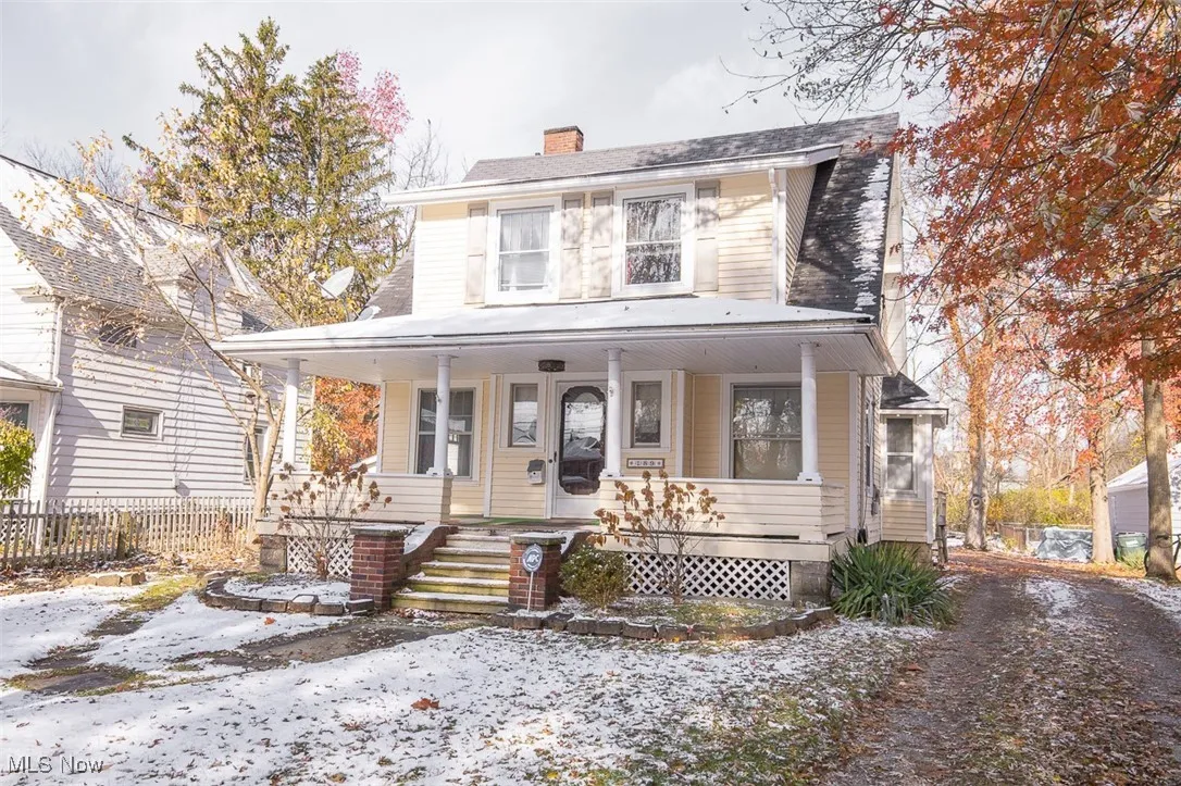 View Double featuring covered porch and a chimney