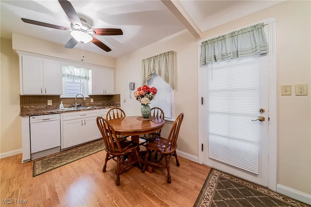 Dining space with light wood-type flooring and a ceiling fan