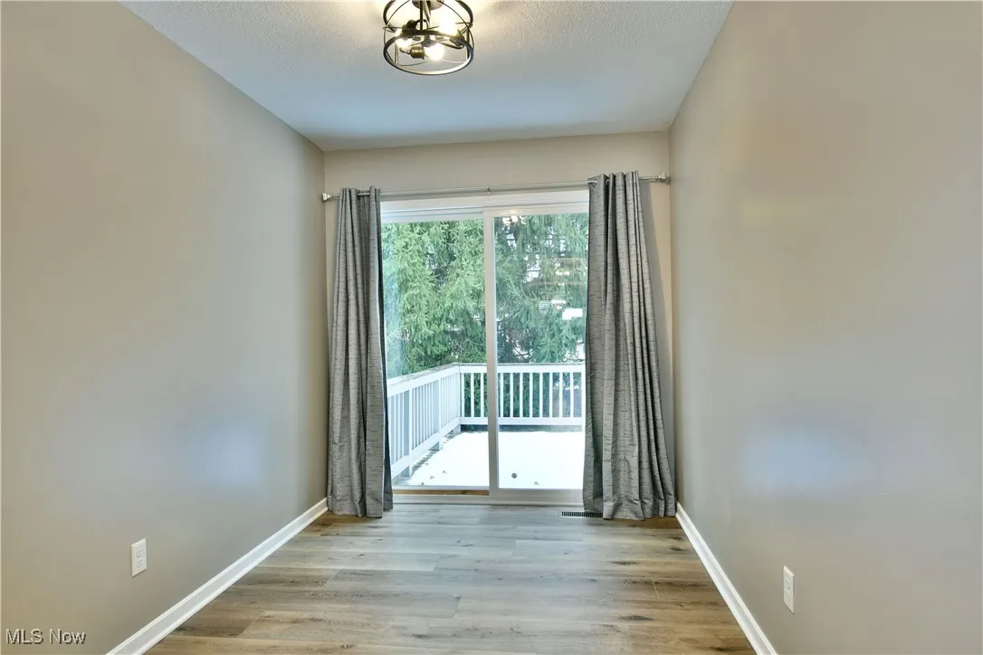 Spare room featuring light wood-type flooring