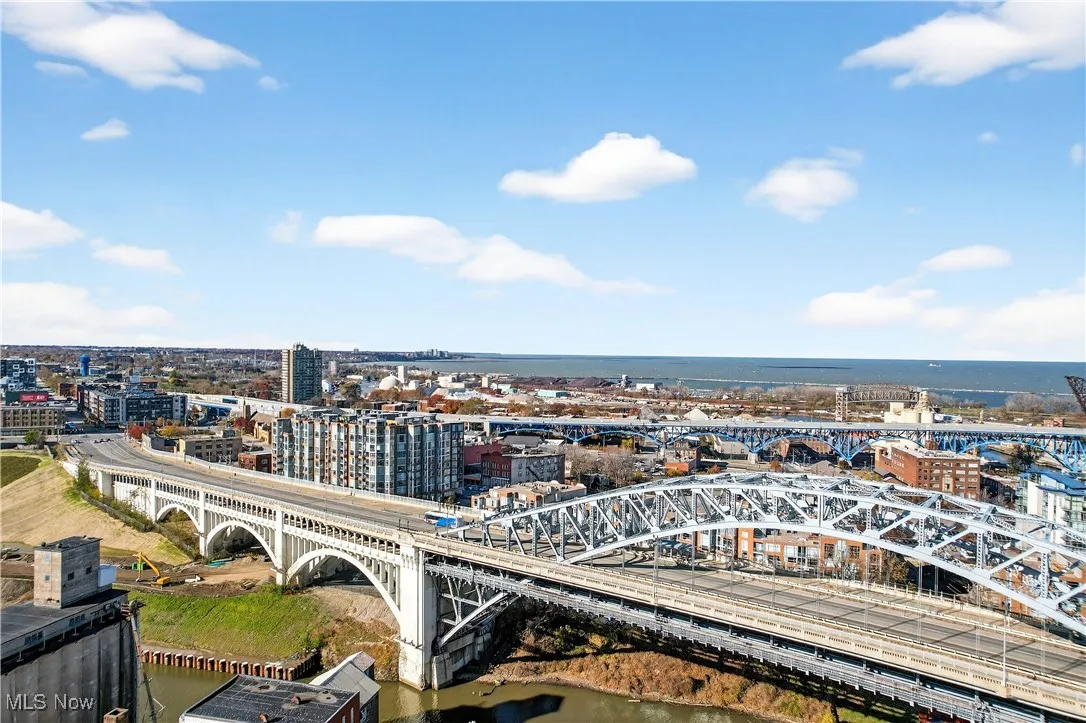 View of urban area with a nearby body of water and a notable bridge