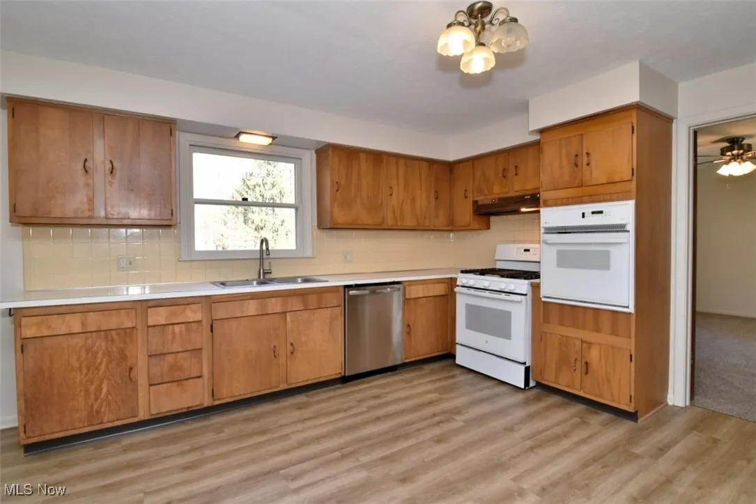 Huge eat in kitchen with loads of cupboard space, two ovens, brand new LVT and fresh neutral paint