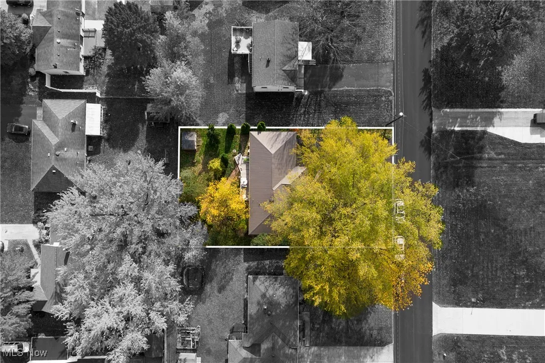 Aerial perspective of suburban area featuring property parcel outlined