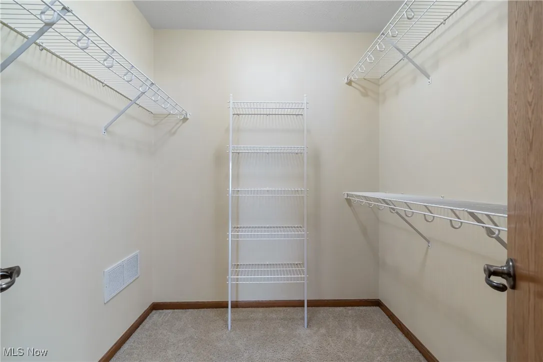 The oversized Walk-in closet with ample shelving for everyone's clothes.