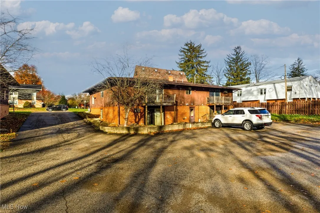 View of front of property featuring a balcony