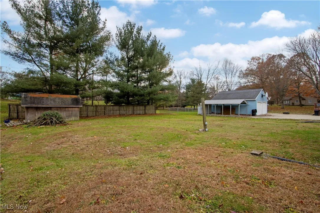 View of yard with a storage shed