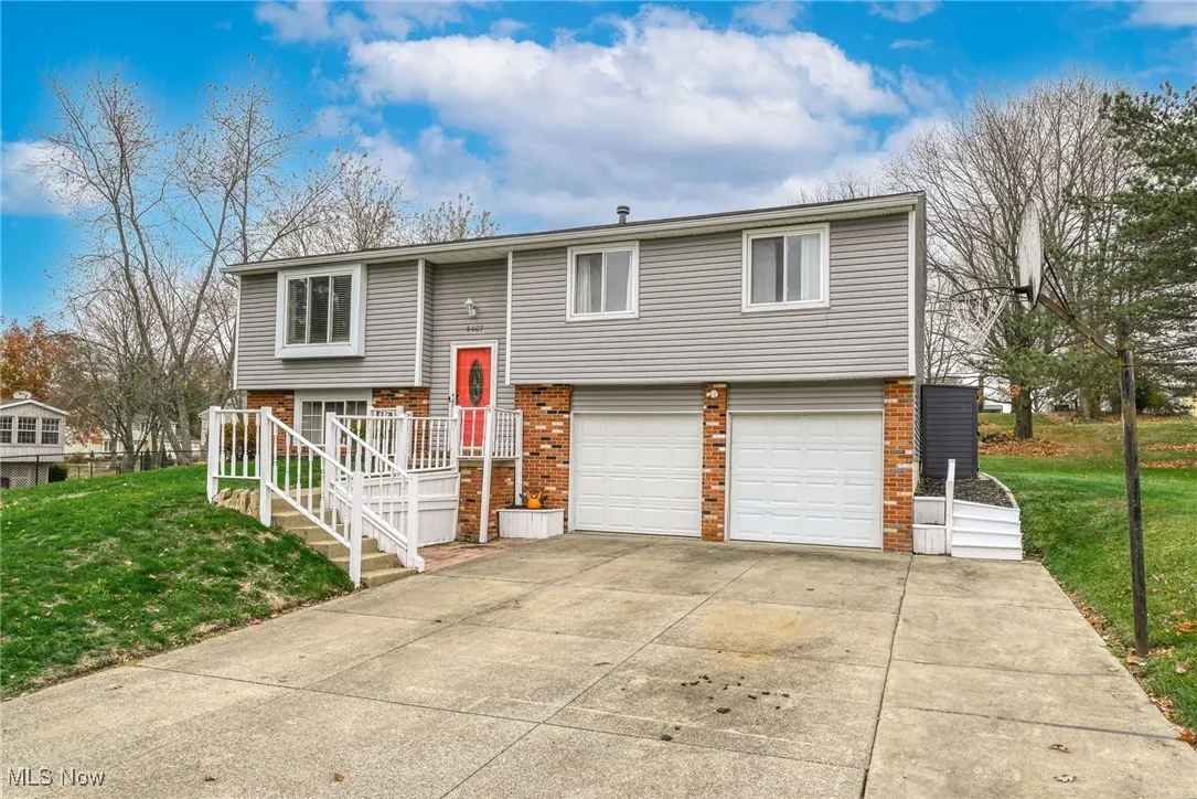 Bi-level home featuring an extra-wide driveway