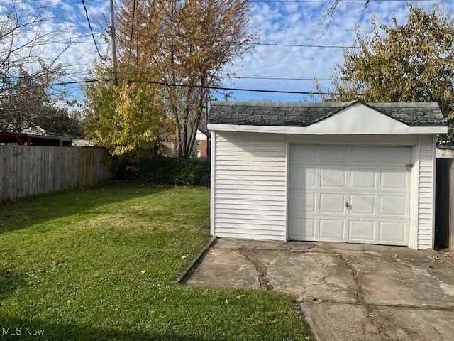 Detached garage with concrete driveway