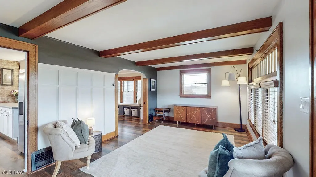 Living room has a nice flow to dining room and kitchen.