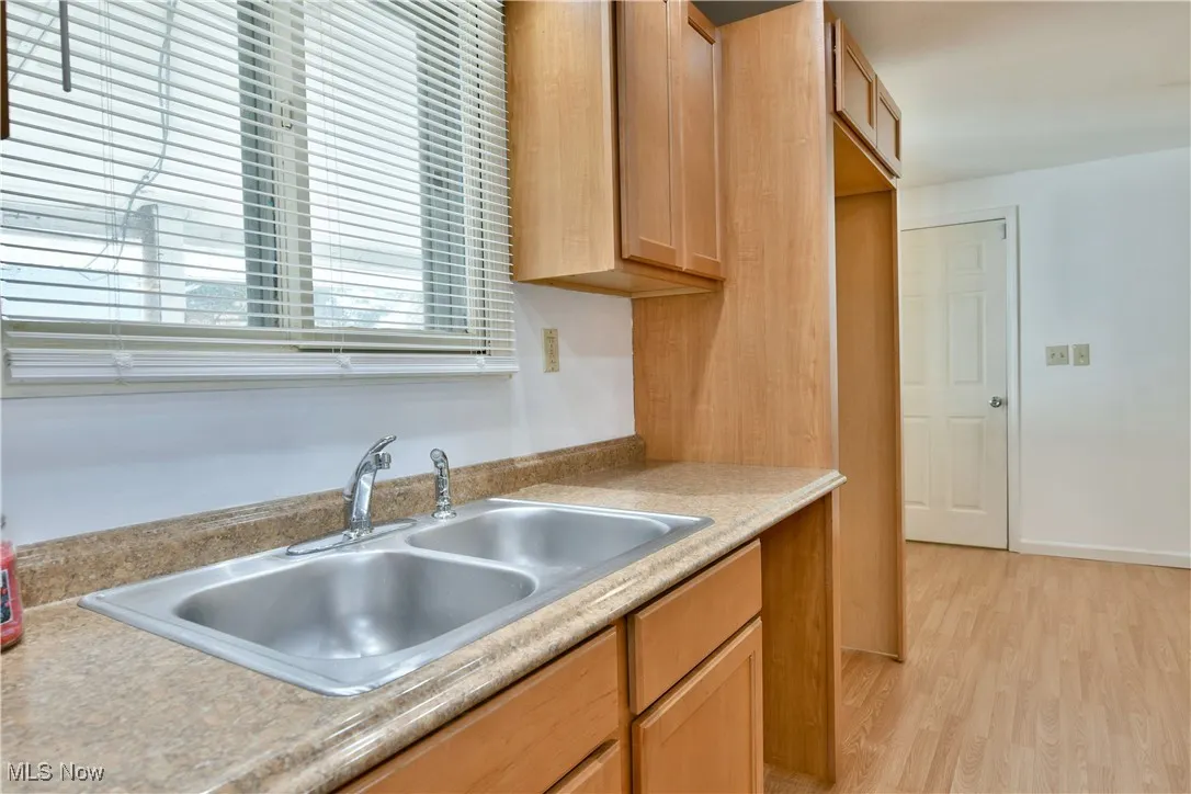 Kitchen featuring light wood finished floors and light countertops