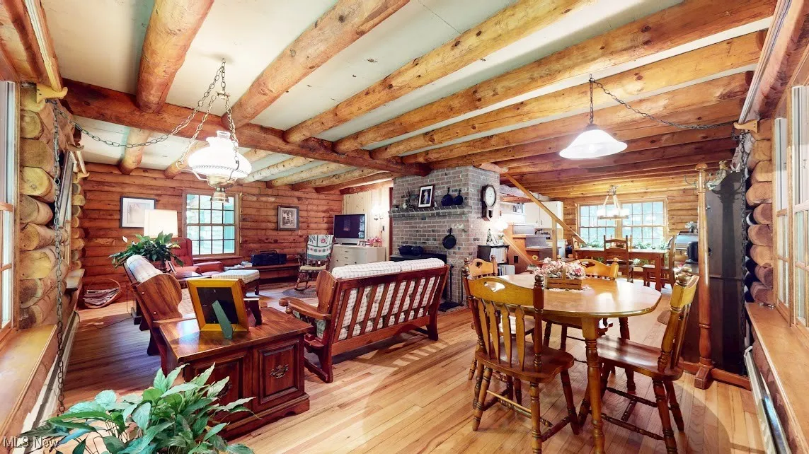 Dining space looking into living room and kitchen