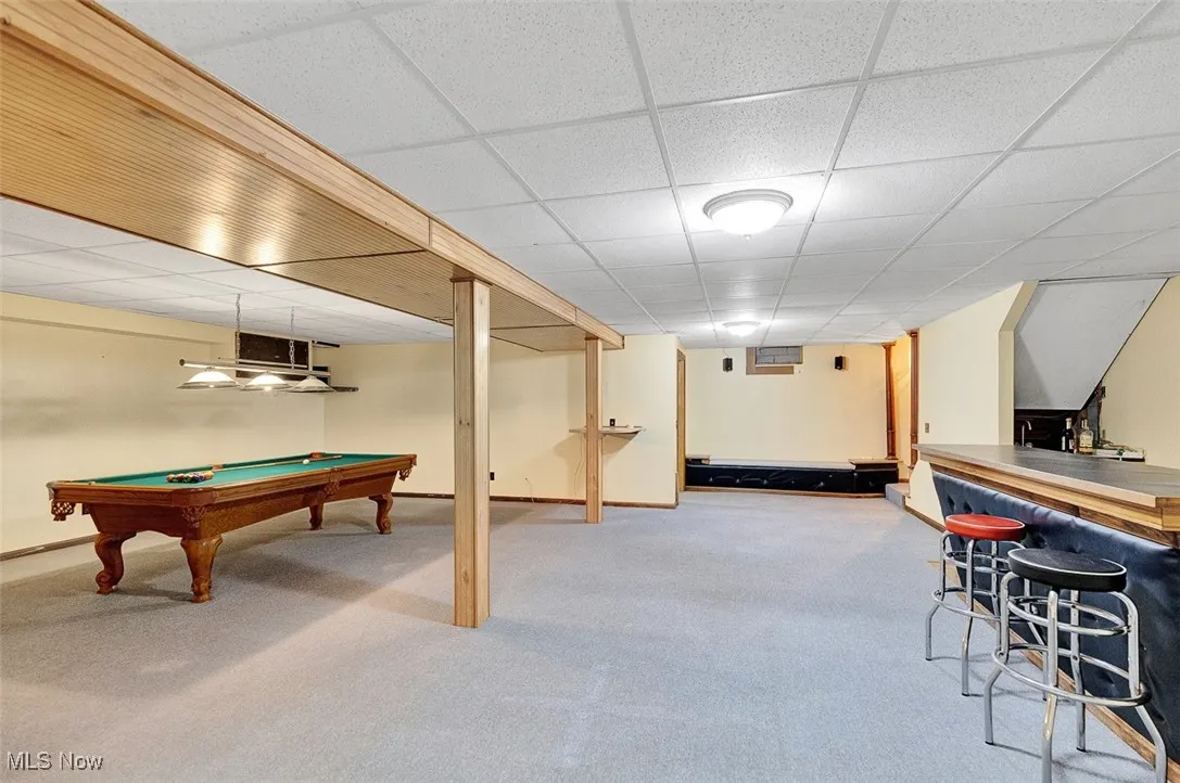 Playroom with billiards table, light carpet, and a drop ceiling
